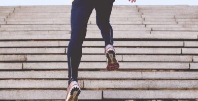 person climbing concrete stairs